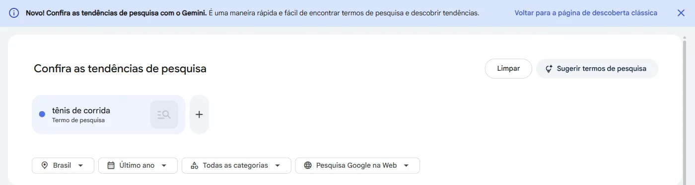 Página Explorar do Google Trends com a faixa Novo, Confira as tendências de pesquisa com o Gemini, o termo tênis de corrida, os botões Limpar e Sugerir termos de pesquisa e os filtros Brasil, Último ano, Todas as categorias e Pesquisa Google na Web.